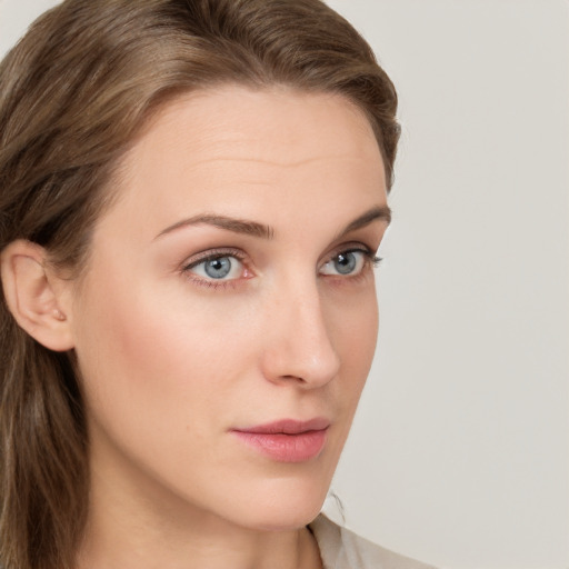 Neutral white young-adult female with long  brown hair and grey eyes