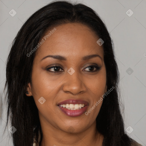 Joyful black young-adult female with long  brown hair and brown eyes