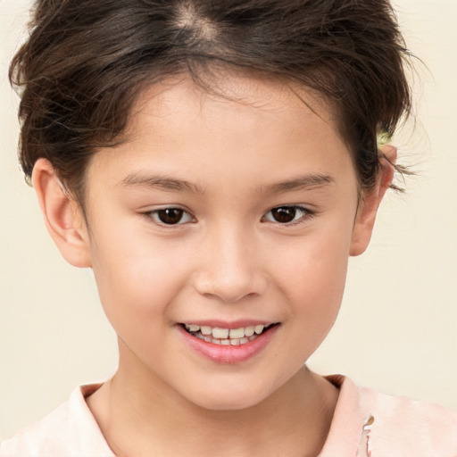 Joyful white child female with short  brown hair and brown eyes