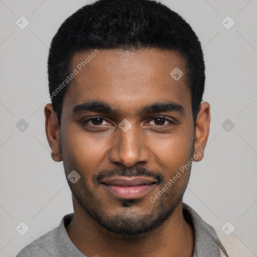 Joyful black young-adult male with short  black hair and brown eyes