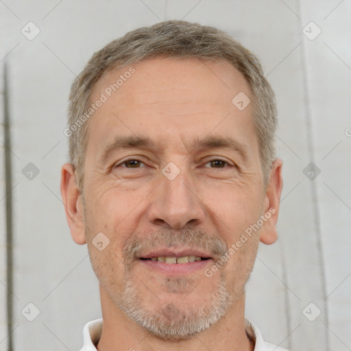 Joyful white adult male with short  brown hair and brown eyes