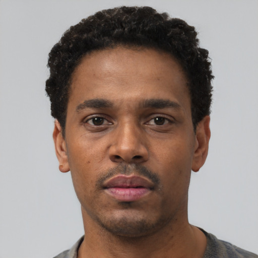 Neutral black young-adult male with short  black hair and brown eyes