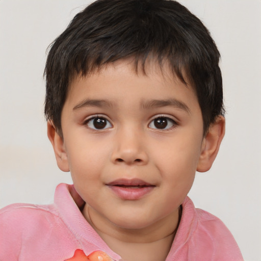 Joyful white child male with short  brown hair and brown eyes