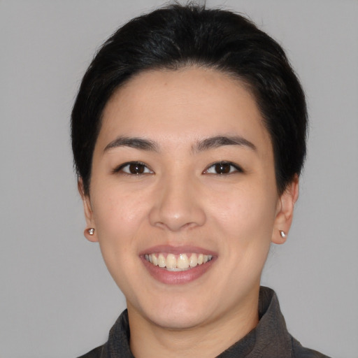 Joyful white young-adult female with medium  black hair and brown eyes