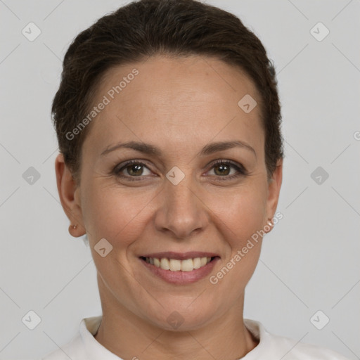 Joyful white adult female with short  brown hair and brown eyes