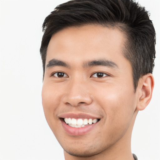 Joyful asian young-adult male with short  brown hair and brown eyes
