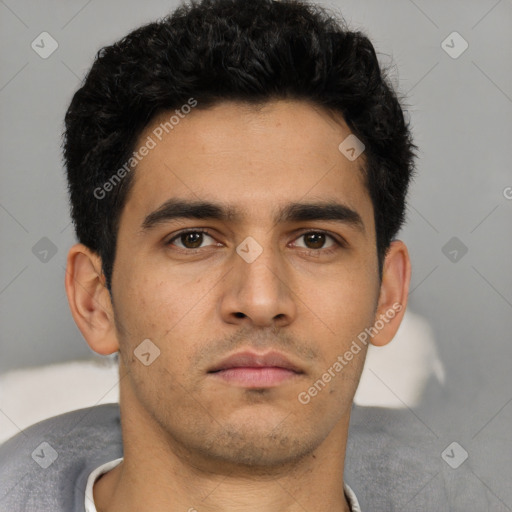 Neutral white young-adult male with short  black hair and brown eyes