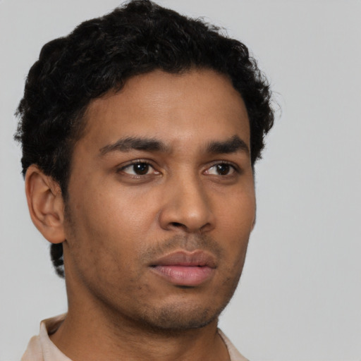 Neutral latino young-adult male with short  brown hair and brown eyes