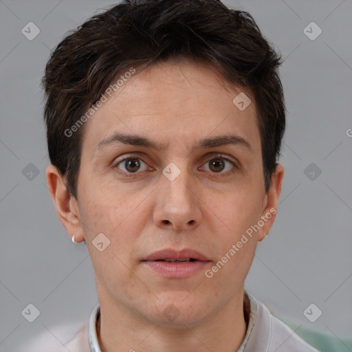 Joyful white adult female with short  brown hair and brown eyes