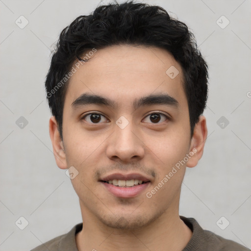 Joyful latino young-adult male with short  black hair and brown eyes