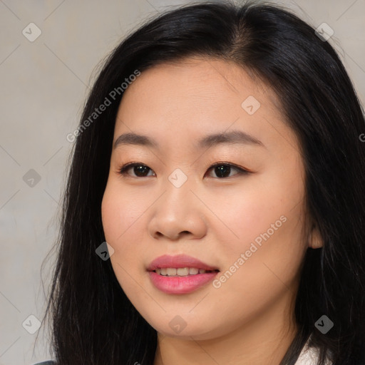 Joyful asian young-adult female with long  brown hair and brown eyes