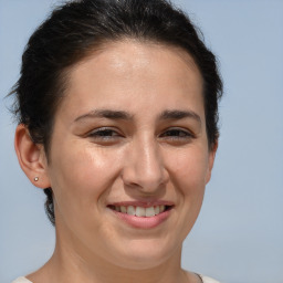 Joyful white adult female with short  brown hair and brown eyes