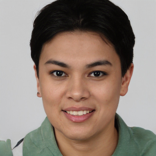 Joyful asian young-adult female with short  brown hair and brown eyes
