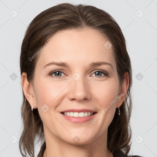 Joyful white young-adult female with medium  brown hair and grey eyes