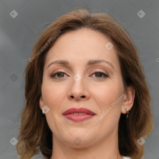 Joyful white adult female with medium  brown hair and grey eyes