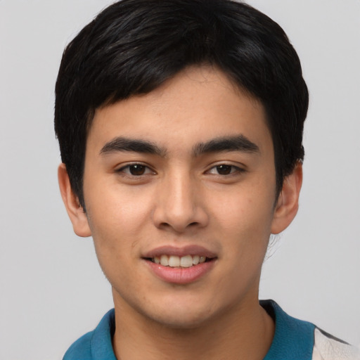 Joyful asian young-adult male with short  black hair and brown eyes