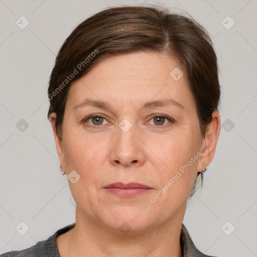 Joyful white adult female with short  brown hair and grey eyes