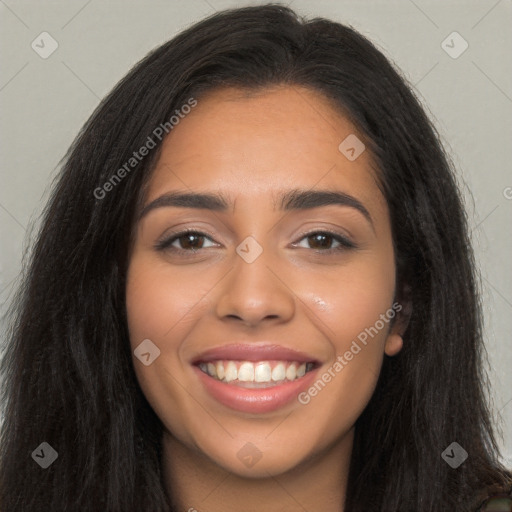 Joyful latino young-adult female with long  brown hair and brown eyes