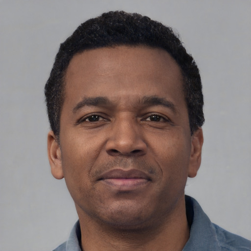 Neutral latino adult male with short  brown hair and brown eyes