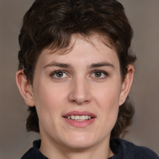 Joyful white young-adult male with medium  brown hair and brown eyes