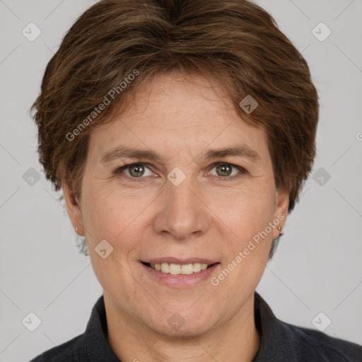 Joyful white adult female with short  brown hair and grey eyes