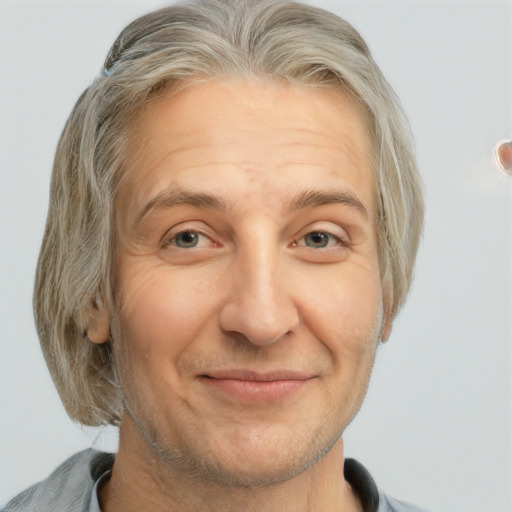 Joyful white middle-aged male with medium  brown hair and grey eyes