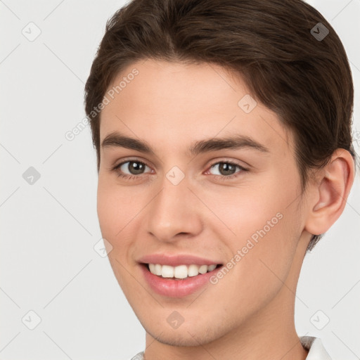 Joyful white young-adult female with short  brown hair and brown eyes