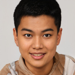 Joyful latino young-adult male with short  brown hair and brown eyes