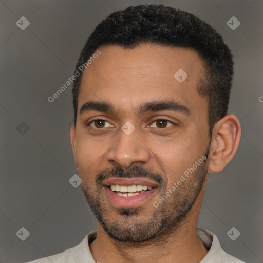 Joyful black young-adult male with short  black hair and brown eyes