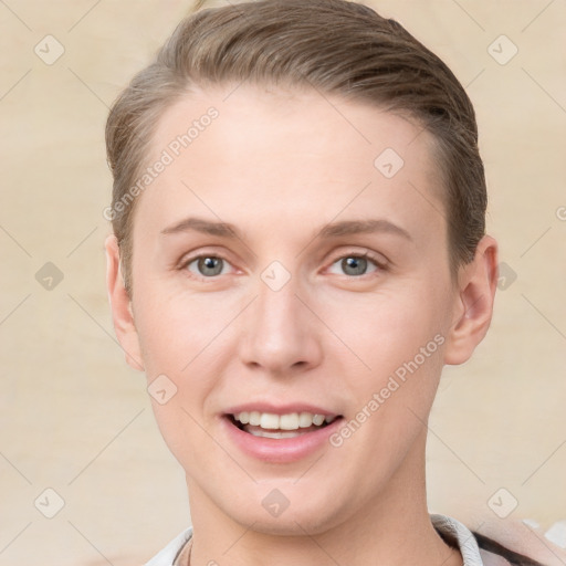 Joyful white young-adult female with short  brown hair and grey eyes