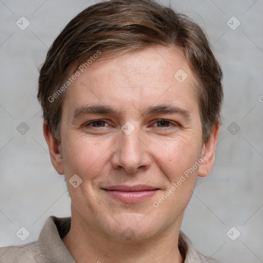 Joyful white adult male with short  brown hair and grey eyes