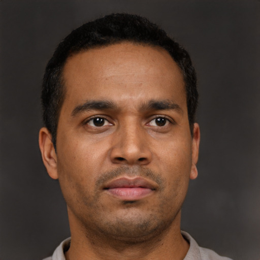 Neutral latino young-adult male with short  brown hair and brown eyes