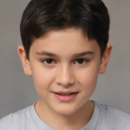 Joyful white child male with short  brown hair and brown eyes