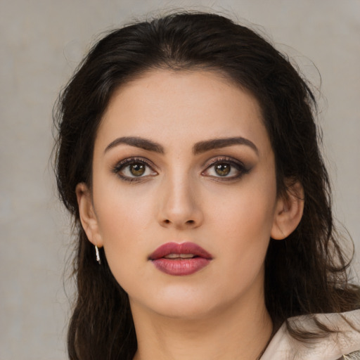 Neutral latino young-adult female with medium  brown hair and brown eyes