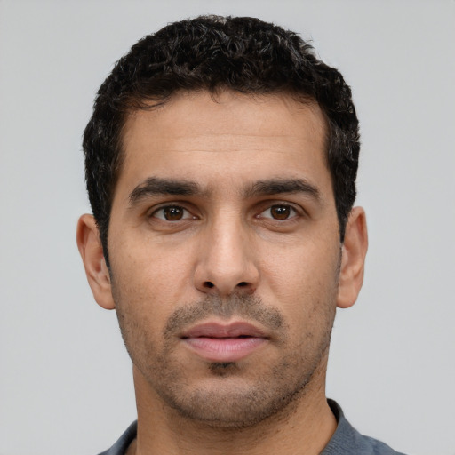 Neutral white young-adult male with short  black hair and brown eyes