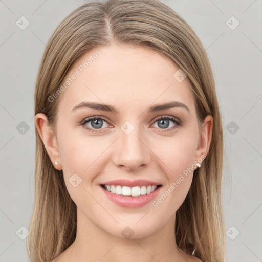 Joyful white young-adult female with long  brown hair and green eyes