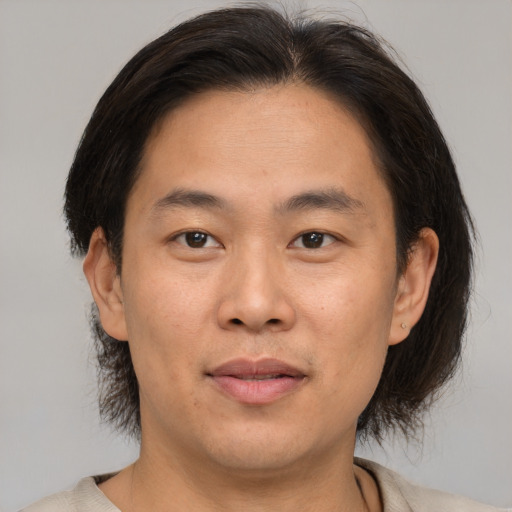 Neutral asian young-adult male with short  brown hair and brown eyes