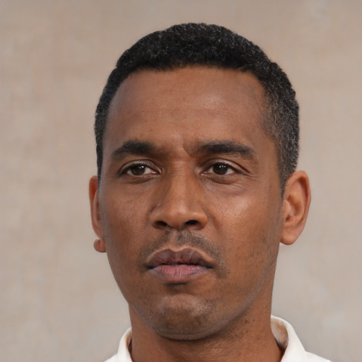 Neutral latino adult male with short  black hair and brown eyes