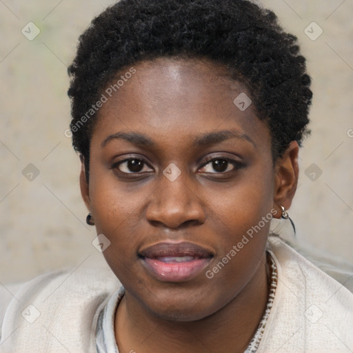 Joyful black young-adult female with short  black hair and brown eyes