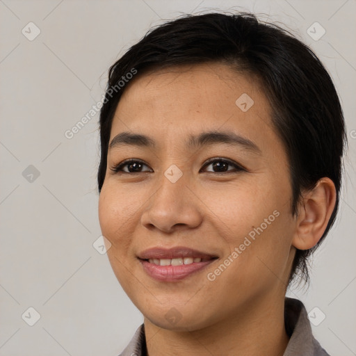 Joyful asian young-adult female with medium  brown hair and brown eyes