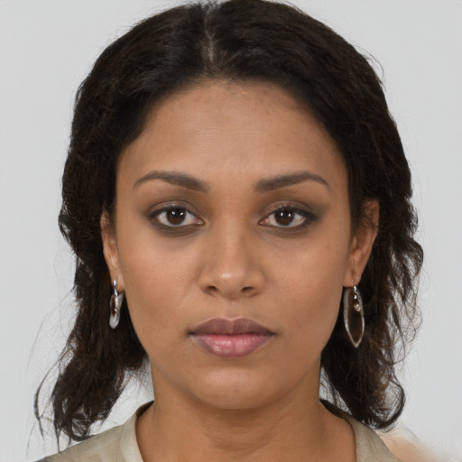Neutral black young-adult female with medium  brown hair and brown eyes