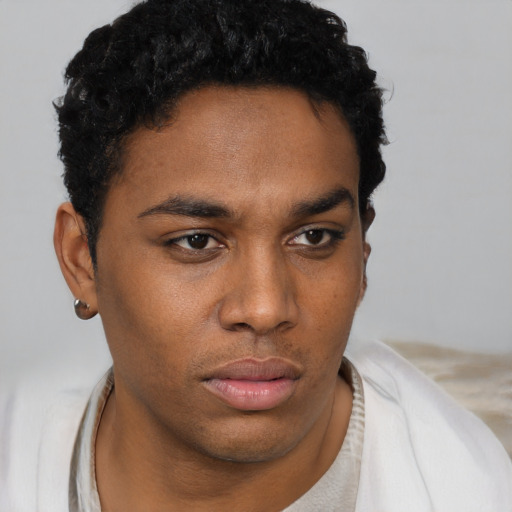 Neutral black young-adult male with short  brown hair and brown eyes