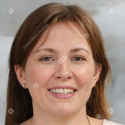 Joyful white adult female with medium  brown hair and brown eyes