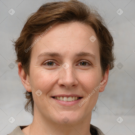 Joyful white adult female with short  brown hair and grey eyes