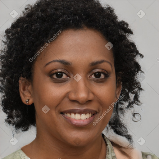 Joyful black young-adult female with medium  brown hair and brown eyes