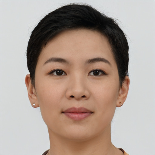 Joyful asian young-adult female with short  brown hair and brown eyes