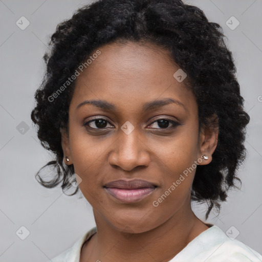 Joyful black young-adult female with long  black hair and brown eyes