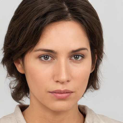 Neutral white young-adult female with medium  brown hair and brown eyes