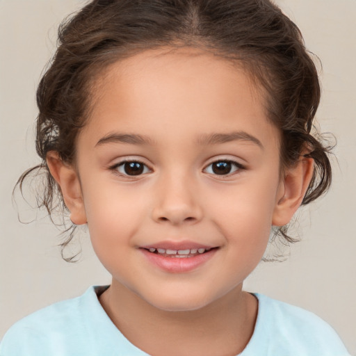 Joyful white child female with medium  brown hair and brown eyes