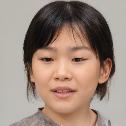 Joyful asian child female with medium  brown hair and brown eyes